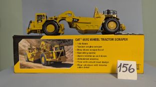 A NORSCOT 1:50 CAT 657G Wheel Tractor Scraper. Collectible Die-Cast Scale Model Replica 55175 with