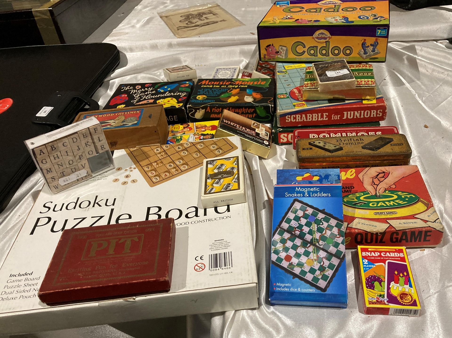 Contents to part table top, assorted games, puzzles, sets of cards including Cluedo, Suduko,