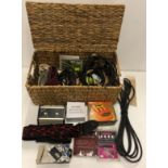 A small wooden crate including guitar straps, a Fender musical instrument corp,