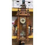A Vienna style mahogany cased wall clock with horse finial and side mirrors,