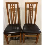 A pair of Artisan solid oak slat-back fining high back chairs with brown leather seats by Morris