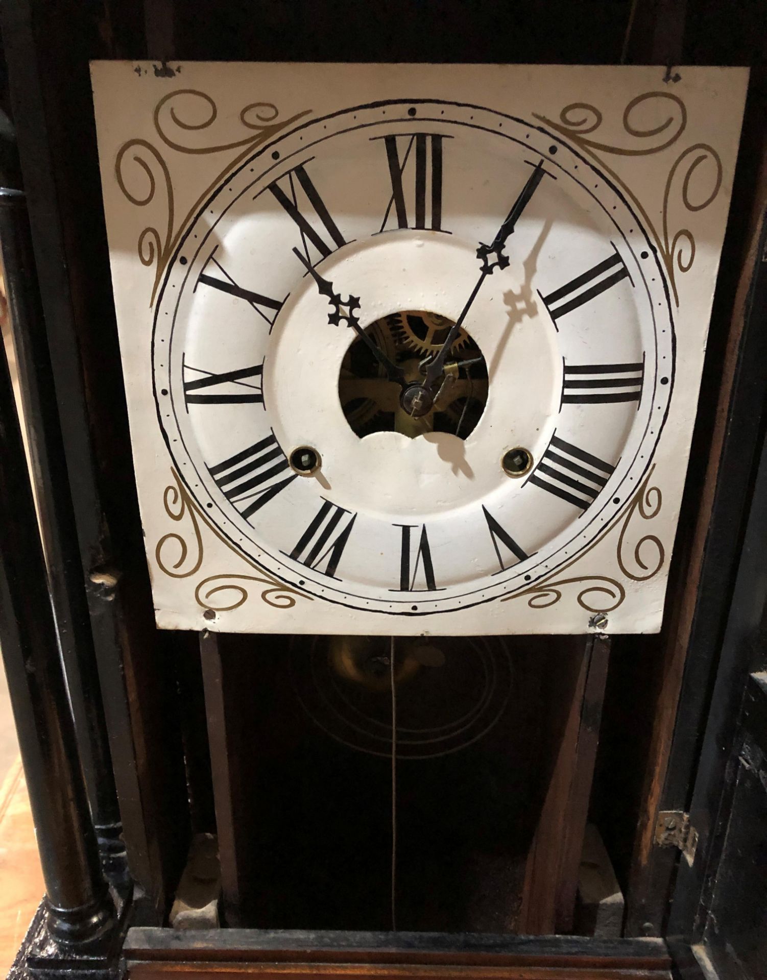 A mahogany framed American wall clock with hand-painted glass panel ...