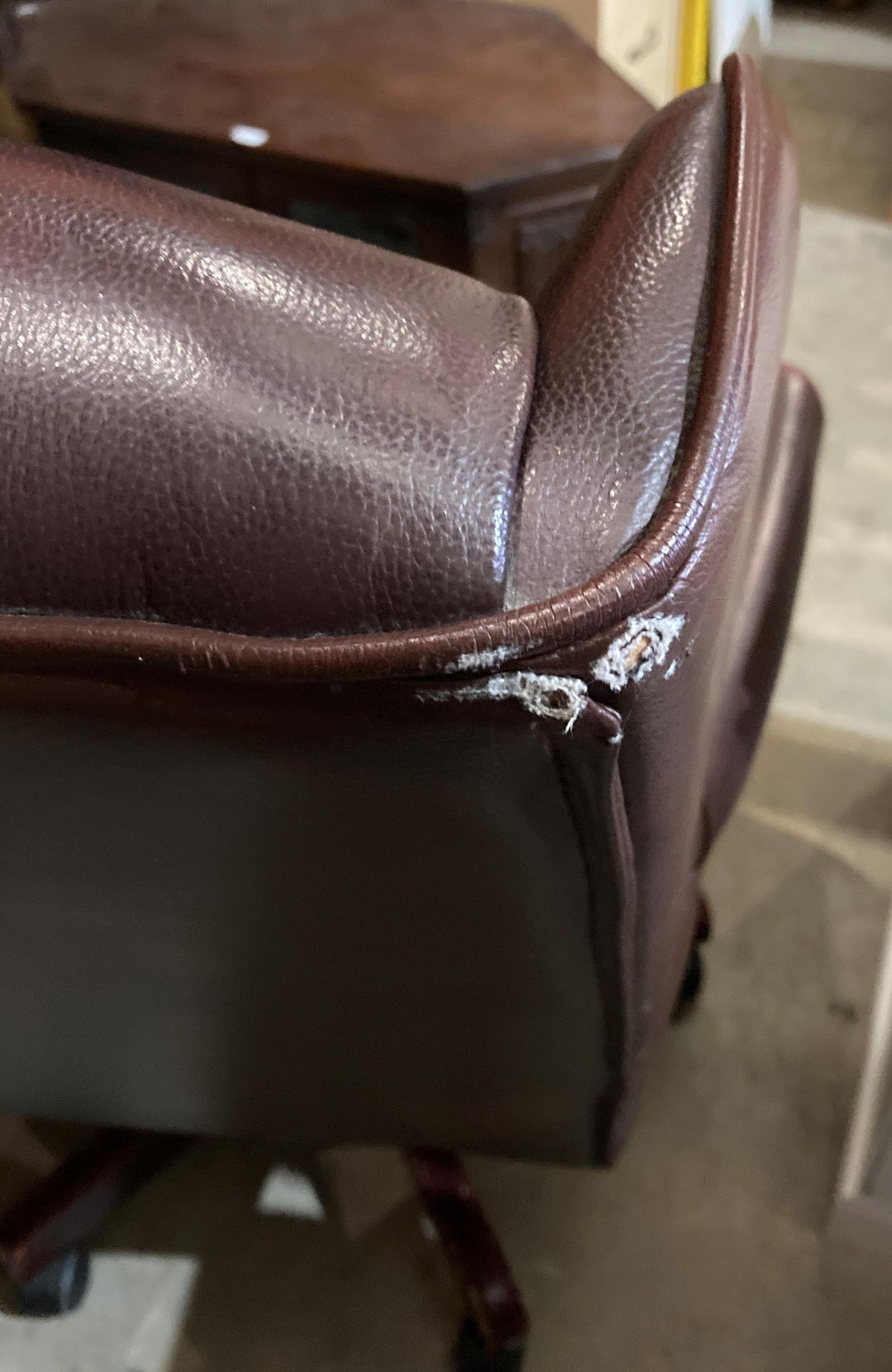 A brown leather high deep buttoned back and seat swivel armchair - please note: slight tear to arms, - Image 5 of 5