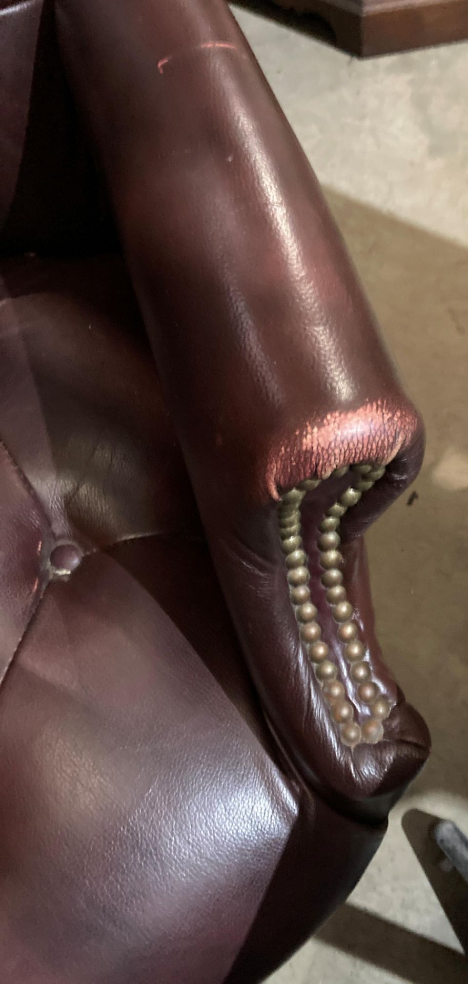 A brown leather high deep buttoned back and seat swivel armchair - please note: slight tear to arms, - Image 2 of 5