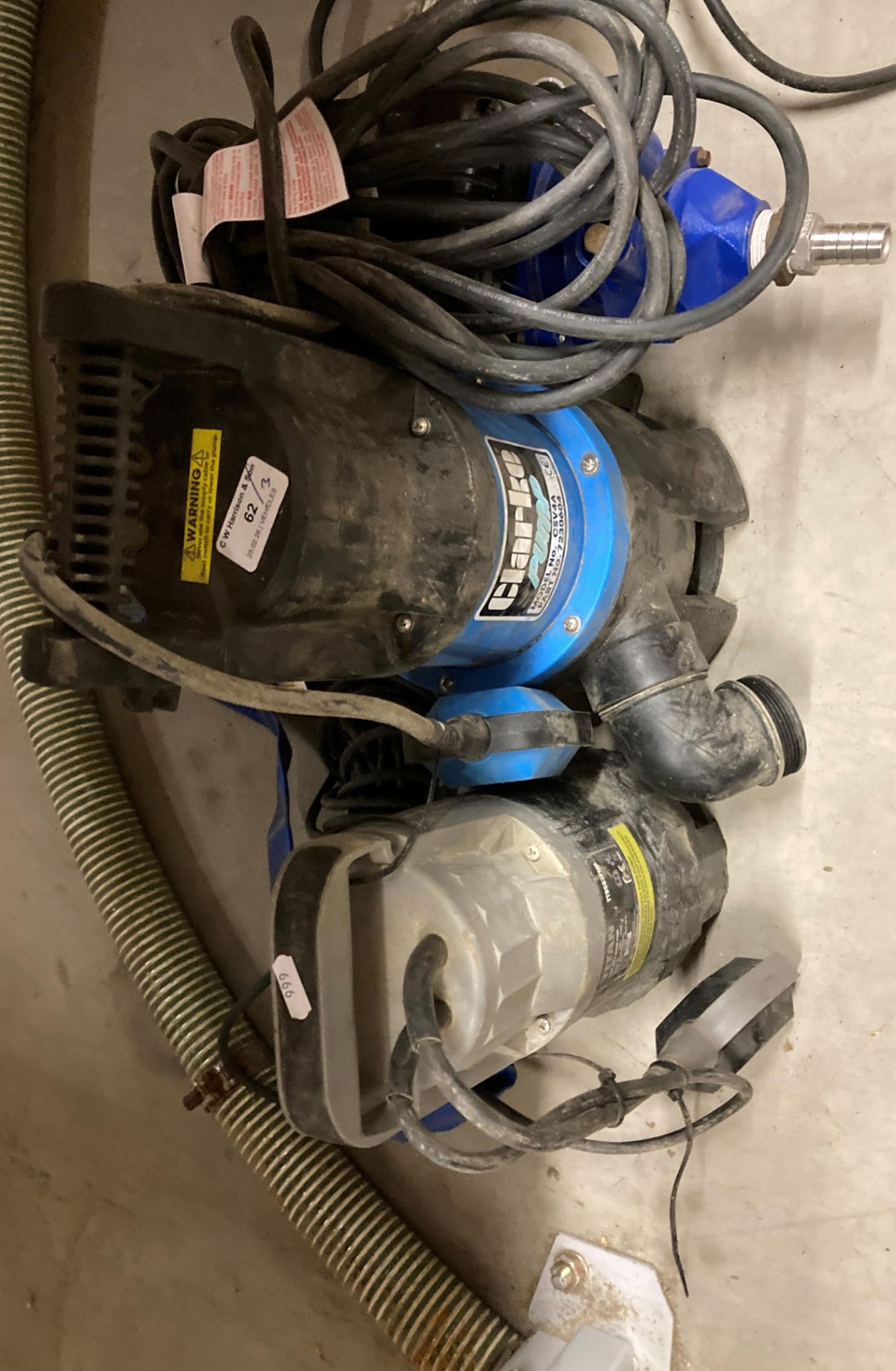 A Clarke sump pump model CSV4A, a Titan sump pump model TTB583PNP,