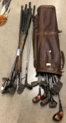Three assorted golf clubs with leather bag (CWH Ref: U07 Floor)