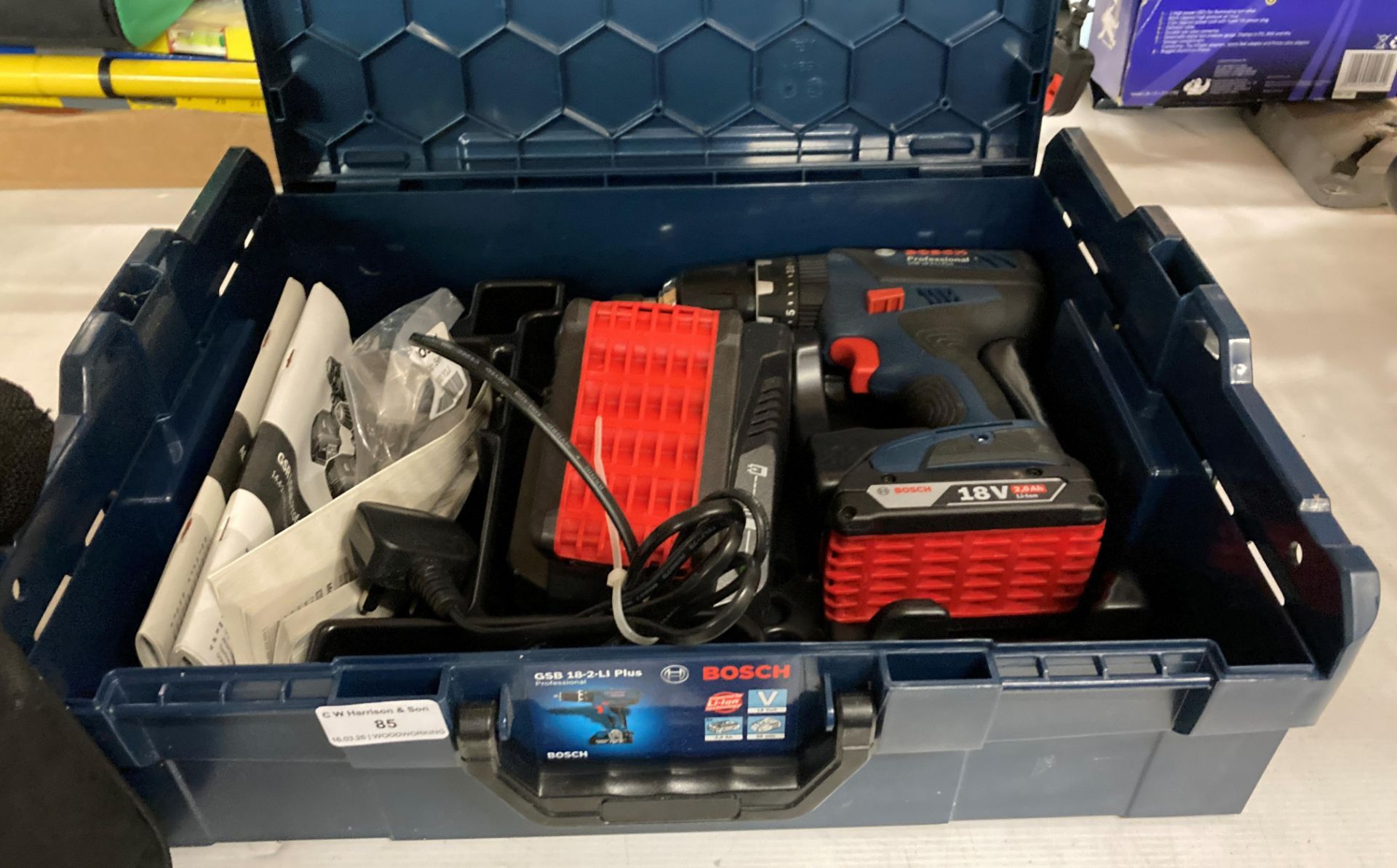 A Bosch GSB 18-2-Li Plus professional cordless drill, complete with charger, two batteries,