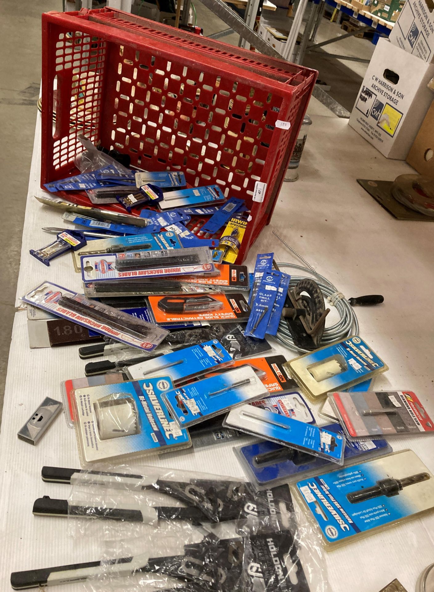 Contents to crate; glass drill bits, bi-metal hole saws, safety knives, water pump, pliers,