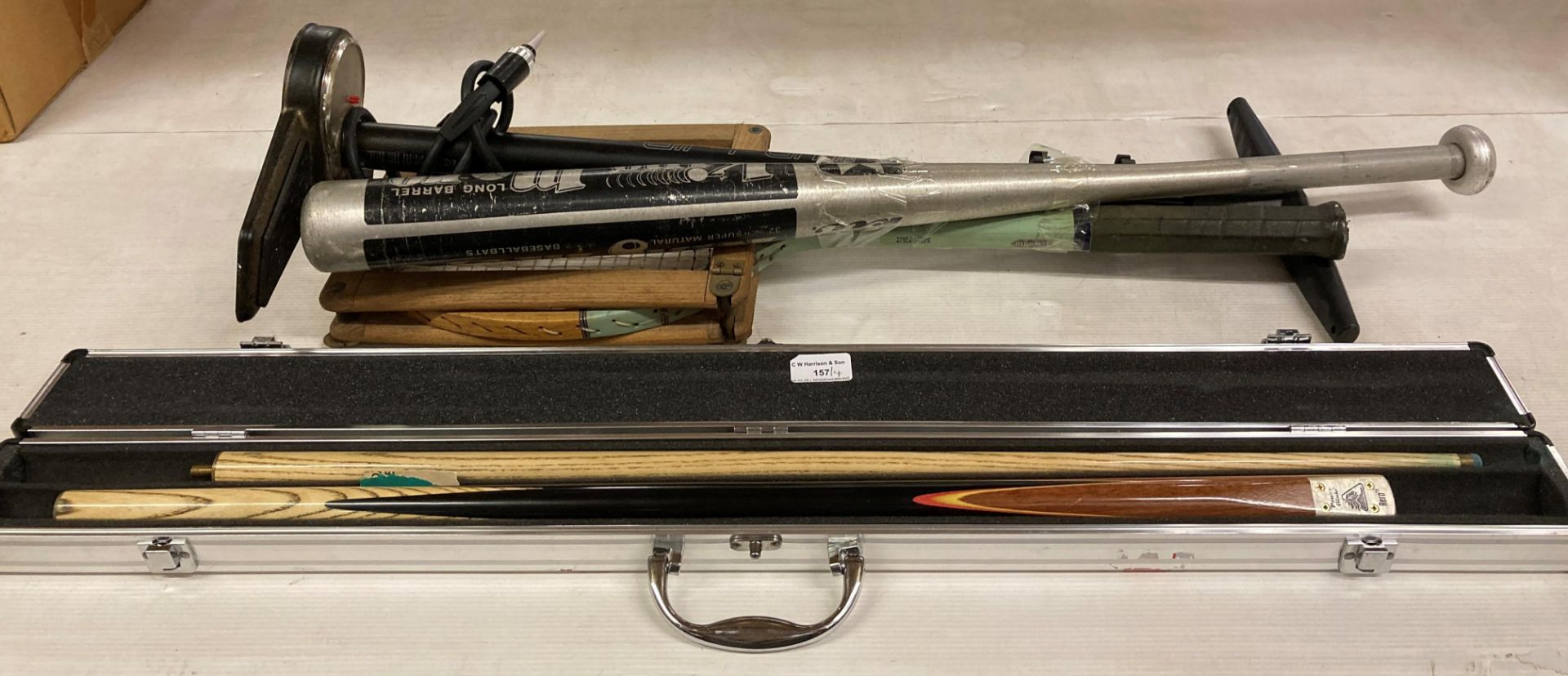 Four items - foot pump, baseball bat, tennis racquet,
