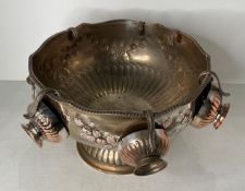 A vintage silver on copper punch bowl with six matching cups,