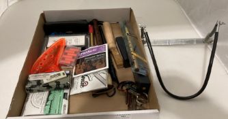 Contents to lid - music related including Hohner Wave quartz guitar tuner,