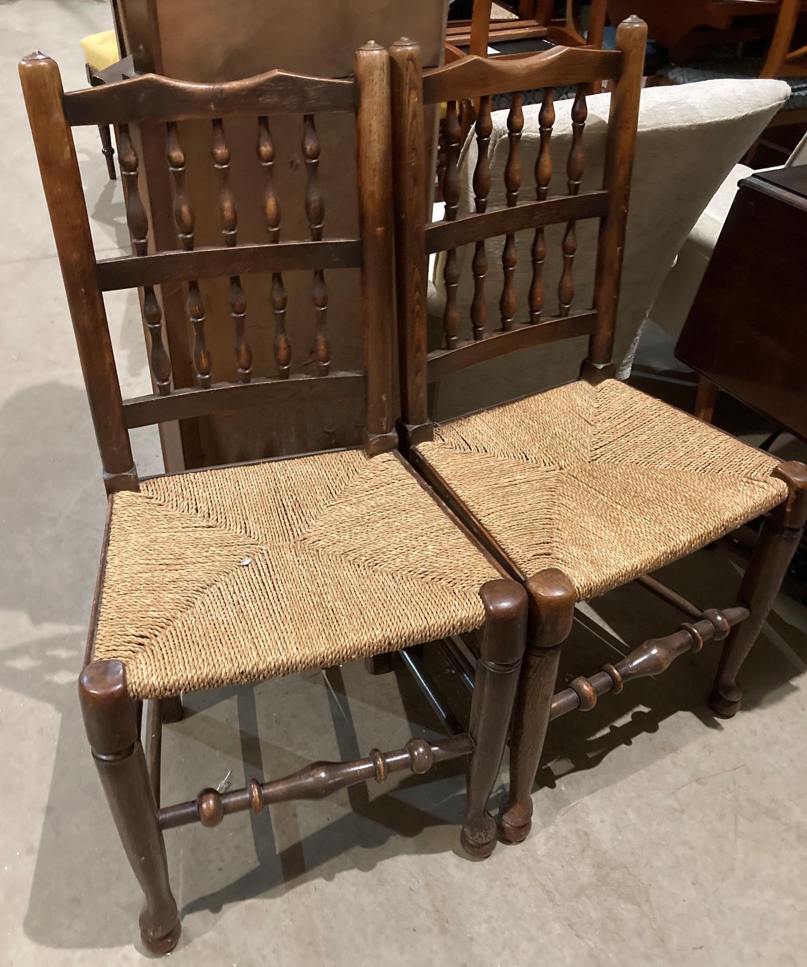 A pair of vintage Lancashire spindle-back chairs with rush seats (CWH REF: MA5)