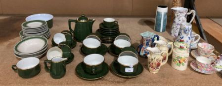 Contents to part of rack - an Apilco green and gilt part tea service (thirty-one pieces),