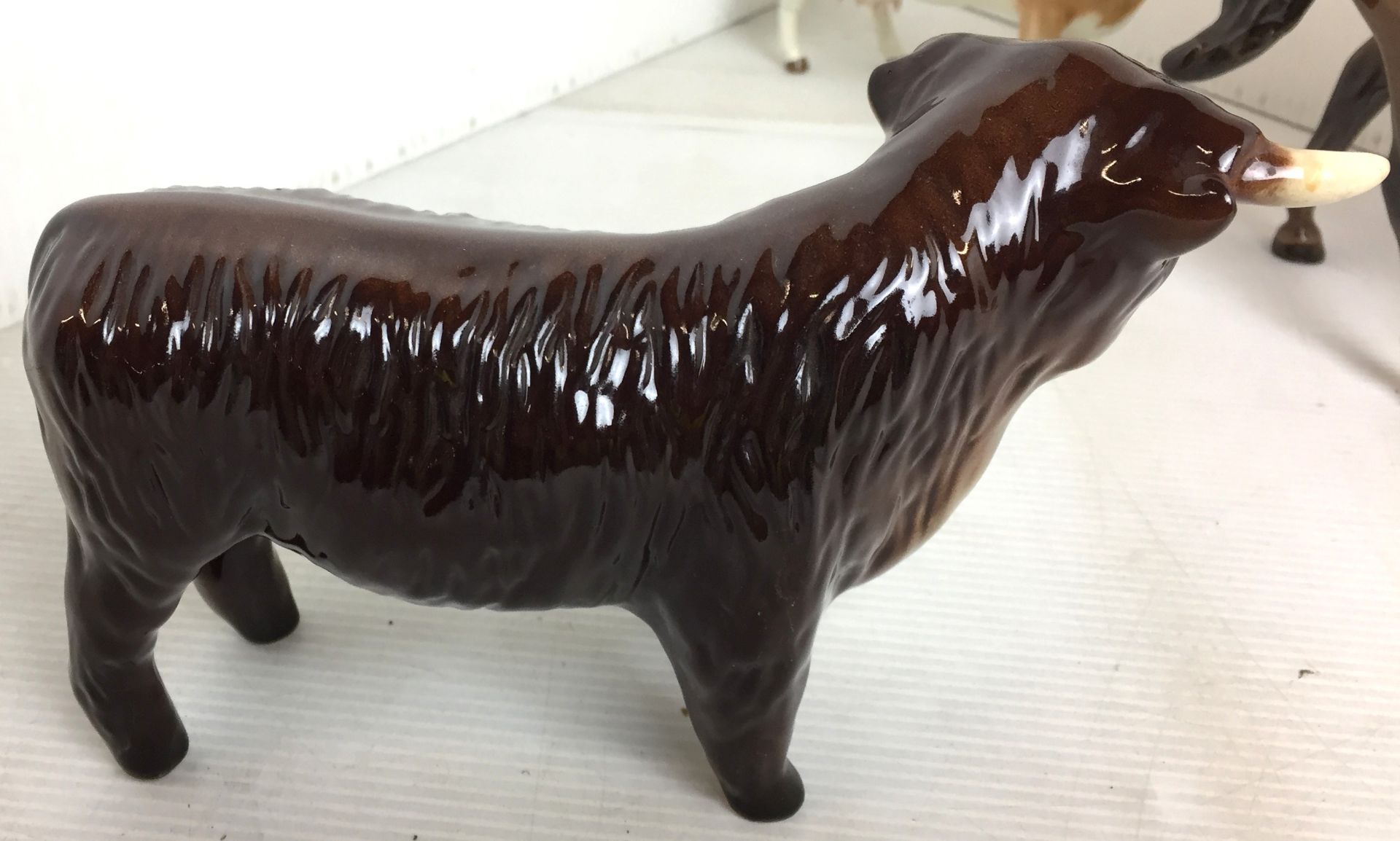 Four items including three Beswick animals including bay prancing stallion19cm high (repair to - Image 13 of 14