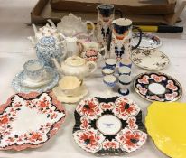Contents to part of rack - teapots, jugs, plates,