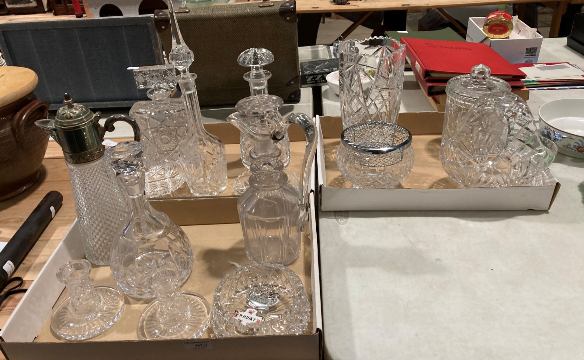 Contents to three trays - a good selection of glassware including a claret jug with plated lid,