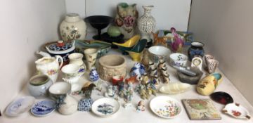 Seventy plus mainly ceramic items including five miniature Disney characters and other miniatures,