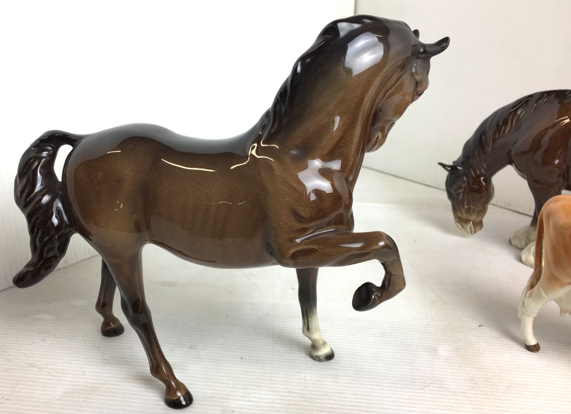 Four items including three Beswick animals including bay prancing stallion19cm high (repair to - Image 3 of 14