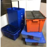 Twenty-three plastic items including stack of eighteen blue plastic supermarket baskets,