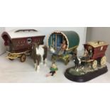 Six items including wooden models of showman's caravan 19cm high and Romany vardo caravan 18cm high,