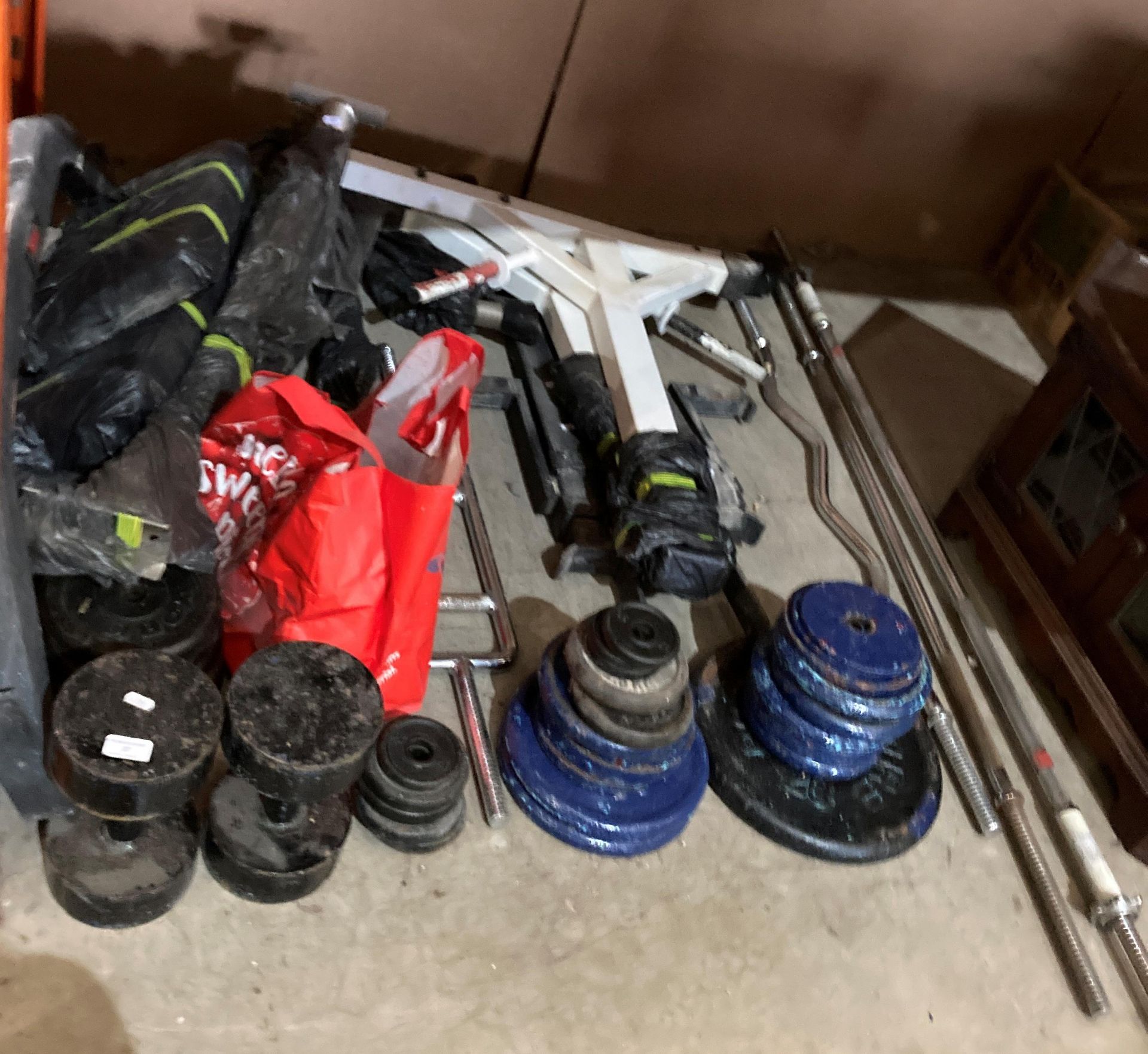 A quantity of weights and weight lifting equipment (contents to under part of rack) (CWH Ref: MA3)