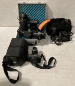 Three assorted cameras in bags - a Pentax P30 with 28x125mm lens,