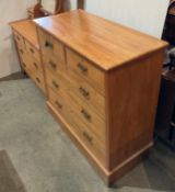 A mid-century pine two-piece bedroom suite,