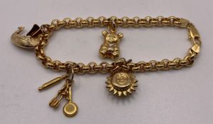A 18ct gold 750 belcher charm bracelet with two 750 18ct charms and one 9ct gold 375 charm one with