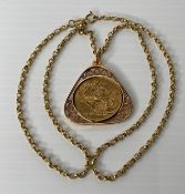 A George V 1914 gold sovereign in a 9ct gold 375 coin holder (pendant with a 9ct gold 375 belcher