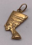 A 18ct gold 750 Nefertiti bust charm pendant, approximate weight 2.