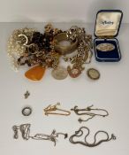 A 9ct gold and silver ring, three silver 925 chains two with pendants (approximate weight: 0.
