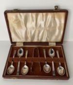 A Mid-Century silver hallmark teaspoons and sugar ting set with an Art Deco 'bar end' design made