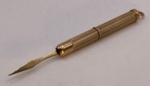 A 9ct gold 375 pocket propelled tooth pick by W.