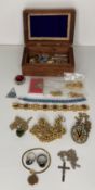 A wooden box and contents - two silver hallmark vintage rings,