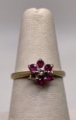A 18ct gold diamond and ruby engagement ring (missing one ruby), size M, approximate weight: 2.