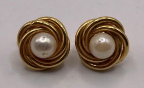 A pair of 18ct gold 750 pearl twist loop earrings, approximate weight: 4.