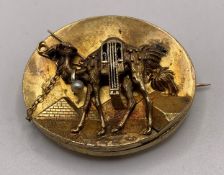 A gold-tone Egyptian Revival brooch (hallmark not visible - possibly pinchbeck) approximate weight: