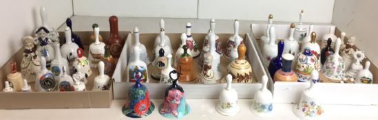 Fifty-eight mainly ceramic bells - two Wedgwood Clementine and Mirabelle, Aynsley Cottage Garden,