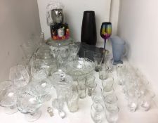 Fifty items mainly glass - blue jug 17cm high, rainbow mirror wine glass 23cm high,
