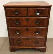 A Georgian style walnut tv/entertainment cabinet with lift up front,