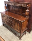 A early 20th Century carved oak sideboard short raised back,