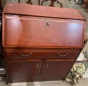 An S Form mahogany two door, single drawer, drop-front bureau 84.5cm wide x 100cm high.
