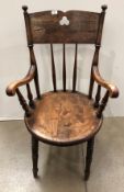 A 20th century farmhouse large penny seat smokers chair with turned legs and spindles (CWH Ref: