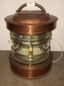 A vintage copper ship's light converted to electric, no plug,