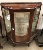 A mid century mahogany glass front china cabinet with mirrored back and glass shelves,