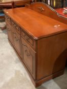 A modern mahogany dining suite, comprising circular extending table, 105cm not extended,