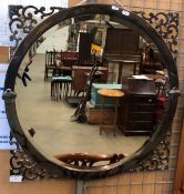 An early 20th century circular silver brass framed wall mirror,