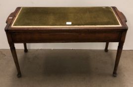 A 20th century mahogany long lift top piano stool,