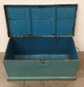 A pine green painted lift top chest,