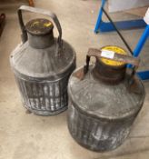 Two vintage ribbed galvanised motor oil cans with handles,